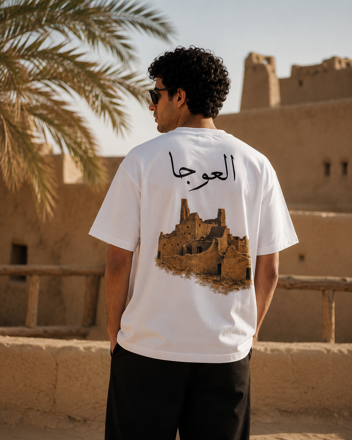 Erth — Al-Awja back print on oversized tee, shot in Diriyah